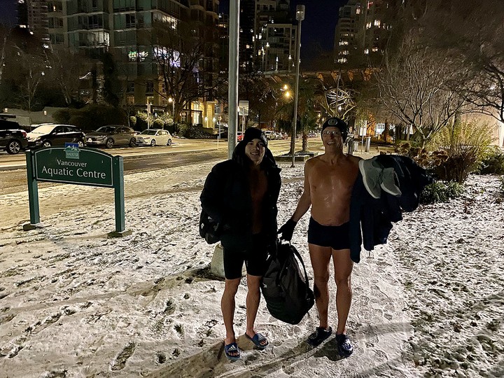 Noah MacDonald (left) and Philip Skinder walking to the Vancouver Aquatic Centre to warm up after a 6:15-a.m. dip in English Bay’s 5C waters on. Friday morning.