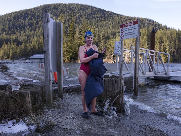  Roberta Cenedese (blue cap) at Buntzen Lake in Anmore, BC Friday, January 12, 2024. The pair are coldwater swimmers who swim several times per week in the winter.