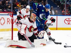 Vancouver Canucks Dakota Joshua (81) tries to tip in the puck as Ottawa Senators goaltender Anton Forsberg (31) watches during the first period at Rogers Arena on Tuesday night.