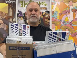 Photo of Dana Larsen sending out the last of his packages to BC MLAs prior to Christmas.