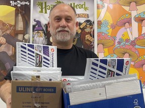 Photo of Dana Larsen sending out the last of his packages to BC MLAs prior to Christmas.