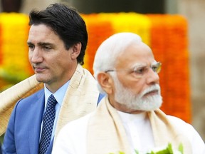 Canada's Prime Minister Justin Trudeau, left, walks past India's Prime Minister Narendra Modi as they take part in a wreath-laying ceremony at Raj Ghat, Mahatma Gandhi's cremation site, during the G20 Summit in New Delhi, Sunday, Sept. 10, 2023.