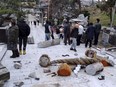 A torii gate is damaged after an earthquake at a shrine in Kanazawa, Ishikawa prefecture, Japan Monday, Jan. 1, 2024.