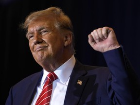 Republican presidential candidate former President Donald Trump gestures after speaking at a campaign event in Concord, N.H., Friday, Jan. 19, 2024.