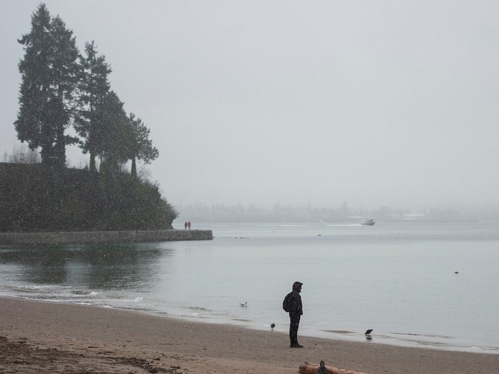  File photo of a person on Third Beach in winter. Photo: Jason Payne/PNG.