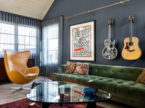 Interior designer Amanda Hamilton mixed her client's existing coffee table, rug, artwork and guitar in with new items.