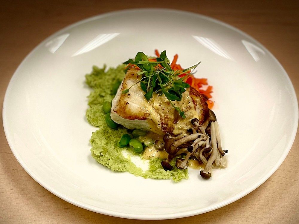 Pan-fried Cod with Salted Duck Egg Yolk Sauce with Edamame Puree and Pickled Shimeji. 