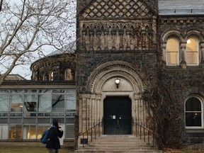 FILE: A student walks through the University of Toronto campus in Toronto, Ontario, Canada, on Tuesday, Dec. 11, 2018.