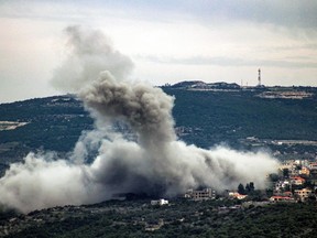 Smoke billows following Israeli bombardment in the village of Shihin in southern Lebanon near the border with Israel on Feb. 13, 2024, amid ongoing cross-border tensions as fighting continues between Israel and Palestinian Hamas militants in the Gaza Strip.