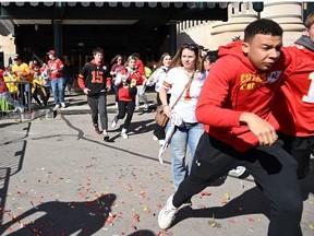 People flee after shots were fired near the Kansas City Chiefs' Super Bowl LVIII victory parade on February 14, 2024, in Kansas City, Missouri.