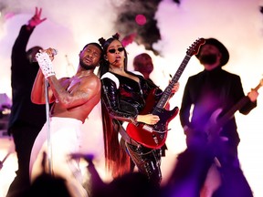 Usher and H.E.R. perform onstage during the Apple Music Super Bowl LVIII Halftime Show at Allegiant Stadium on February 11, 2024 in Las Vegas, Nevada.