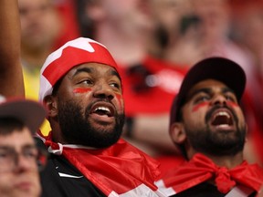 Team Canada fans celebrate before a game in Qatar in 2022. Toronto and Vancouver will host some of the games during the 2026 event.