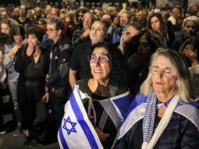 A woman reacts as she attends a vigil demanding government action for return of the hostages abducted by Palestinian terrorists during the Oct. 7 attack and currently held in the Gaza Strip, outside the Israeli parliament in Jerusalem on Nov. 7, 2023.
