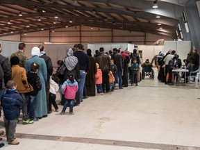 Syrian refugees line up at a processing centre in Amman, Jordan, to meet with Canadian immigration officials, in 2015.