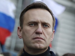 Alexei Navalny takes part in a march in memory of opposition leader Boris Nemtsov in Moscow on Feb. 29, 2020. Russia's prison agency says Navalny has died. He was 47.