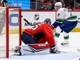 Nils Hoglander (21) scores a goal past Washington Capitals goaltender Darcy Kuemper (35) during the second period in Washington on Sunday.