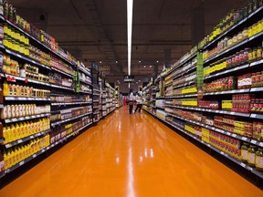 Experts say the main factors that have driven grocery prices up over the past couple of years are global ones. People shop at a Loblaws store in Toronto on Thursday, May 3, 2018.