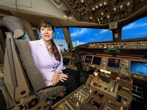 Captain Judy Cameron sits in an aircraft simulator, in Toronto, Monday, Jan. 29, 2024.