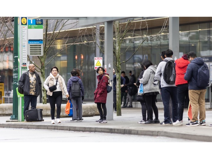  People wait to board buses at Joyce-Collingwood Station in Vancouver. The R4 Rapid Bus, which serves the station, was the second busiest route in the region last year.