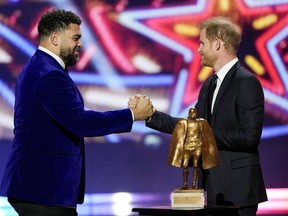 Britain's Prince Harry presents the Walter Payton Man of the Year Award to Pittsburgh Steelers' Cameron Heyward during the NFL Honors award show ahead of the Super Bowl 58 football game Thursday, Feb. 8, 2024, in Las Vegas. The San Francisco 49ers face the Kansas City Chiefs in Super Bowl 58 on Sunday.