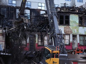 The jury in a coroner's inquest into the Winters Hotel fire in Vancouver two years ago has been stood down to deliberate its recommendations about the deadly blaze. Debris falls to the ground as demolition resumes on the Winters Hotel after a body was found in the single room occupancy (SRO) building, in Vancouver, B.C., Friday, April 22, 2022.