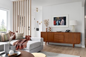 After the owners' daughter raised concerns about buying everything new, Steeves helped the family source a vintage Danish teak credenza for the living room – in a large size to keep the space visually streamlined. A Frank Herzog print complements the piece perfectly.