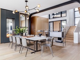 Skylights, windows and a see-through fireplace let light flood into the main dining area.