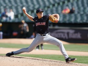 Cade Smith of the Cleveland Guardians pitches in the bottom of the sixth inning against the Oakland Athletics at Oakland Coliseum on March 30, 2024. This was Smith's Major League debut.