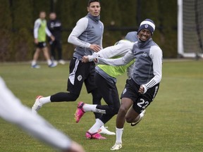 Vancouver Whitecaps midfielder Ali Ahmed runs hard during practice at UBC, but any water break will have to wait until sunset, in accordance with Ramadan.