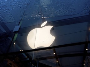 An Apple logo hangs at a Palo Alto, Calif., Apple store on Friday, Feb. 2, 2024.