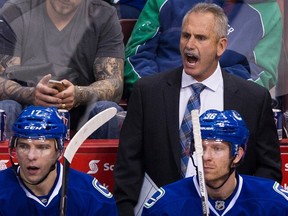 Vancouver Canucks mentor Willie Desjardins coaches against the Edmonton Oilers in a regular- season NHL game at Rogers Arena on Dec. 26, 2015.