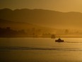 A SeaBus passenger ferry crosses Burrard Inlet, in Vancouver, on Monday, Aug. 14, 2023. Police in Port Moody, B.C., say a man may be charged after he allegedly drove his vehicle into the sea as part of a livestreamed video.