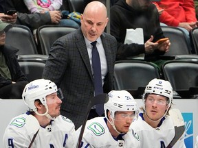 Vancouver Canucks head coach Rick Tocchet. Nikita Zadorov said Tocchet's approach, where he speaks mostly supportively but occasionally critically, is necessary.