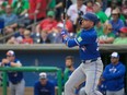 Canadian baseball player Joey Votto is trying to extend his career by playing with the Toronto Blue Jays this year. He issued a handwritten apology for earlier remarks he made about Canadian baseball. THE CANADIAN PRESS/Steve Nesius