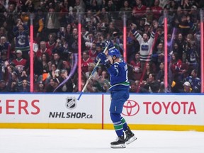 Vancouver Canucks' Nikita Zadorov celebrates his first goal against the Montreal Canadiens during the first period of an NHL hockey game in Vancouver, on Thursday, March 21, 2024.