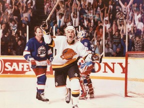 Canucks winger Geoff Courtnall celebrates his overtime goal against the Jets on March 30, 1991.