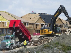 The Canada Mortgage and Housing Corp. says construction of new homes in Canada's six largest cities remained stable at near all-time high levels last year, driven by a surge of new apartment starts despite demand still outpacing supply for rental housing. New homes are built in Ottawa on Monday, Aug. 14, 2023.