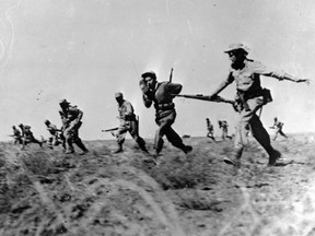 Israeli infantry making a full assault on Egyptian forces in the Negev area of Israel during the war of independence.