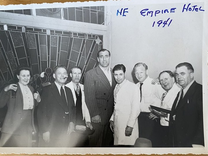  Group photographed at the New Empire Hotel, 1941. Santo Brandolini with cigar in mouth, famous heavyweight boxer Primo Carnera in the middle, and Jack Brandolini, second from Carnera’s left. Primo was from the same region of Italy that the Brandolinis were from.