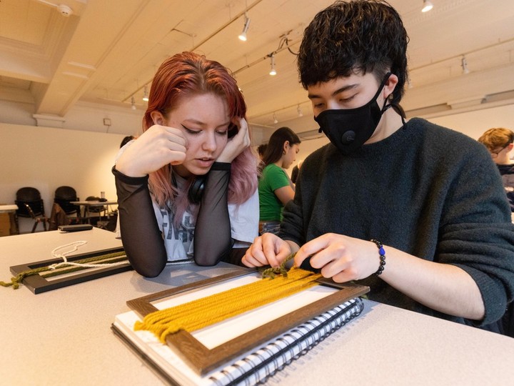  Bobo Lee Culham is watched by Imogen McMahon during a weaving art class at Vancouver Art Gallery in Vancouver.