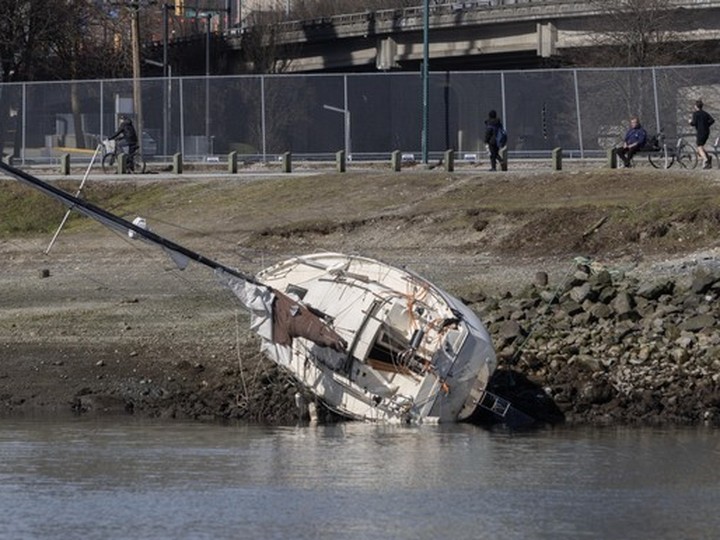  Boat that had gone aground at low tide in False Creek.