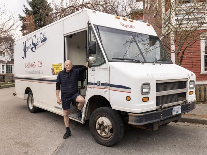  Mike Bryan with his milk truck in Vancouver, B.C., March 21, 2024. Dairyland (which is now Saputo) is stopping home delivery of milk at the end of March.