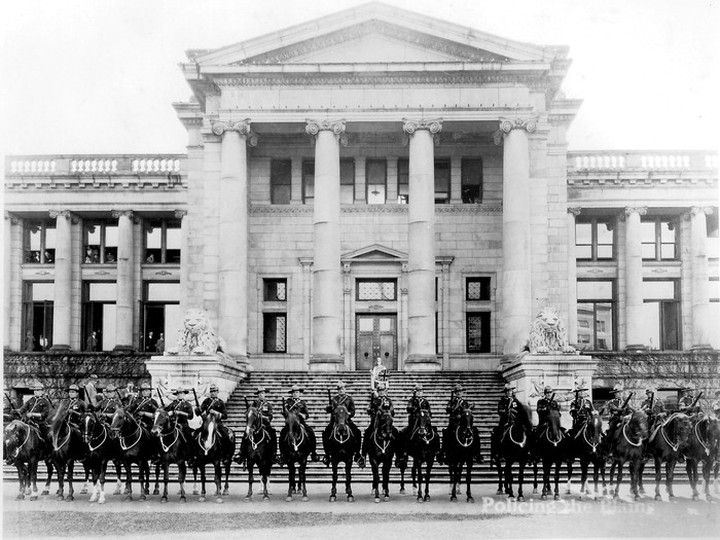  A portion of E Division of the RCMP, who assisted at the filming of one of the opening scenes in the A.D. (Cowboy) Kean film Policing the Plains. This photo was taken in May 1924 outside the courthouse in Vancouver, which is now the Vancouver Art Gallery.