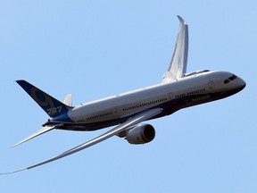 A Boeing 787-9 is pictured during an air display on the second day of the Farnborough International Air show in Hampshire, England, on July 15, 2014.