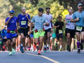 People run near during the Montreal Marathon on Sept. 24, 2023. “Most training programs are too aggressive,” says Reed Ferber, professor in the Department of Kinesiology at University of Calgary and director of the Running Injury Clinic, who recommends taking 20 or more weeks to get marathon ready.