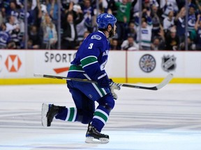Kevin Bieksa of the Vancouver Canucks skates to centre to celebrate after scoring the game-winning goal in double overtime in game five at Rogers Arena to win the Western Conference Finals series 4-1 during the 2011 Stanley Cup Playoffs.