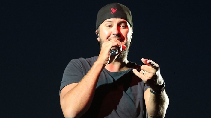 Luke Bryan falls on Vancouver stage after slipping on cellphone