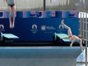 A frame from a video handout by the Metropole du Grand Paris authority shows French diver Alexis Jandard falling while diving at the Olympic Aquatics Centre in Saint-Denis.