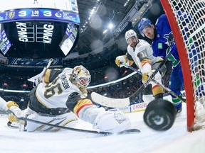 Conor Garland of the Vancouver Canucks scores his second goal of the game on goaltender Logan Thompson of the Vegas Golden Knights during the second period at Rogers Arena on April 8, 2024 in Vancouver.