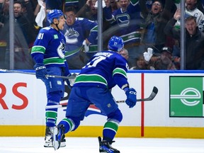 The Vancouver Canucks' Dakota Joshua celebrates his third-period goal with Filip Hronek against the against the Nashville Predators in game 1 of the First Round of the 2024 Stanley Cup Playoffs at Rogers Arena on April 21, 2024.